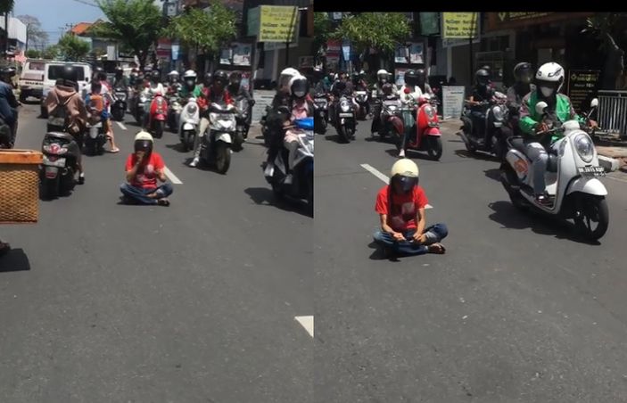 Viral! Pria Berbaju Merah Duduk di Tengah Jalan hingga Sebabkan Macet, Netizen: Buat Konten Itu