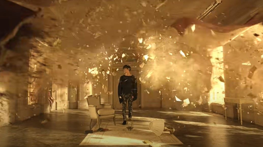 Adegan Jin dalam Film Out yang berdiri di sebuah ruangan, yang kemudian ruangan tersebut hancur.