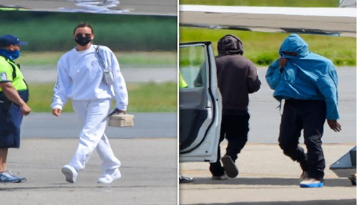 Irina Shayk, mantan pacar Cristiano Ronaldo, dan Kanye West berjalan meninggalkan bandara Teterboro, New Jersey pasca ulang tahun Kanye di Prancis  
