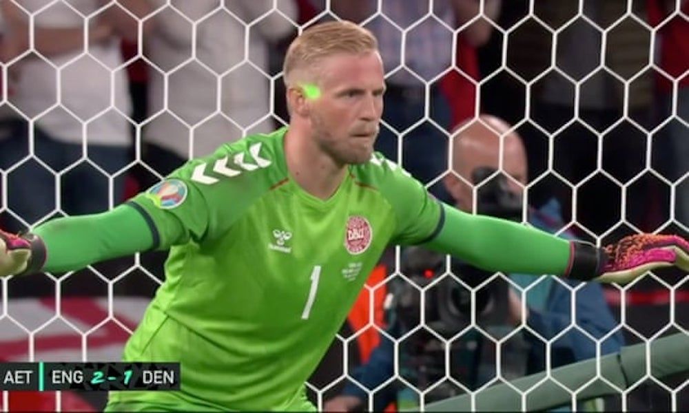 A screengrab showing a laser pointer being shone on Kasper Schmeichel’s face. 