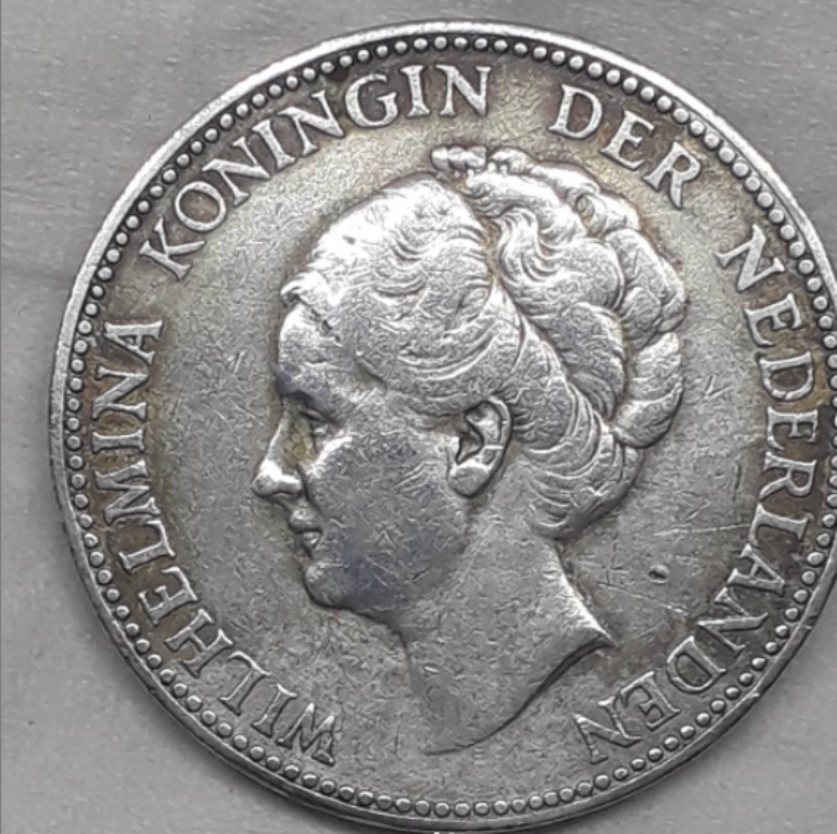 Ilustrasi: Uang kuno Hindia Belanda bergambar Ratu Wilhelmina.