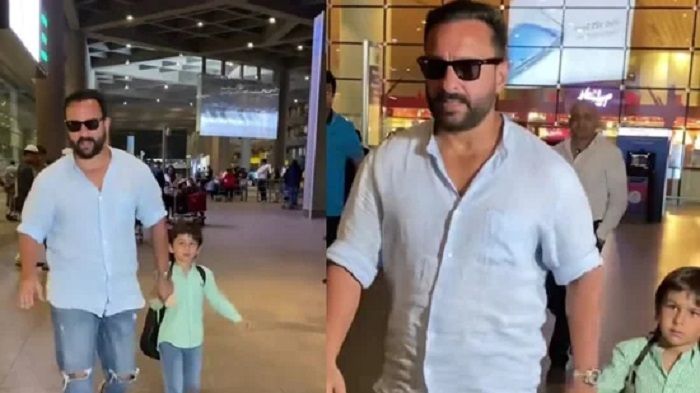 Saif Ali Khan dengan putranya Taimur Ali Khan di bandara Mumbai.*  