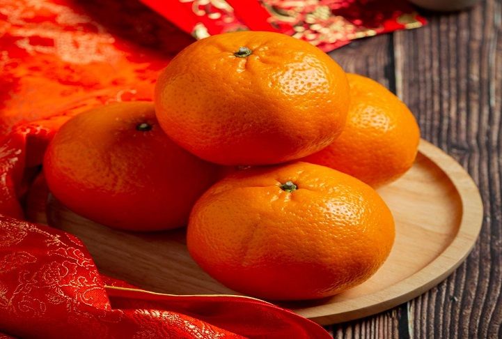 Ilustrasi jeruk yang merupakan salah satu jenis sajian makanan yang dinilai sebagai pembawa keberuntungan saat perayaan tahun baru Imlek.