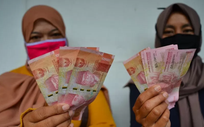 Ilustrasi - Penerima bansos Ramadhan 2023 berupa PKH dan BPNT.