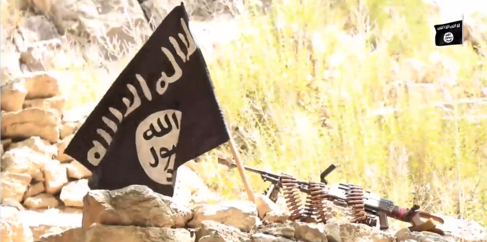 Ilustrasi bendera Isis yang dikibarkan para anggotanya dalam sebuah pertempuran