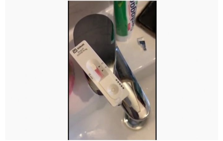 Tangkapan layar video hoaks tentang alat tes cepat reaktif dengan air keran. (Whatsapp)